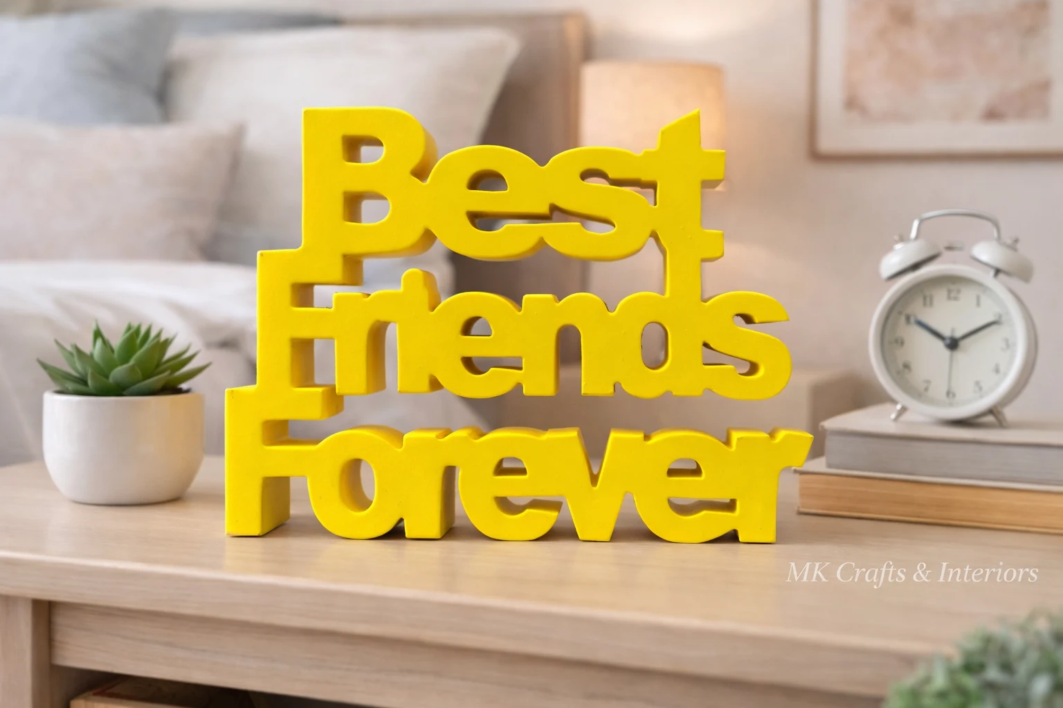 Yellow wooden “Best Friends Forever” decorative showpiece by MK Crafts placed on a shelf with plants and candles – handcrafted friendship gift décor.