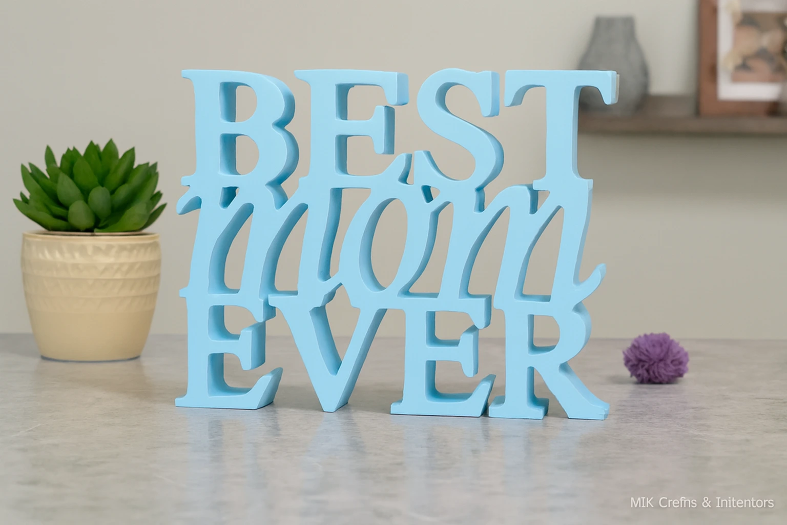 Light Blue wooden “Best Mom Ever” decorative showpiece by MK Crafts displayed on a table with plant décor – handcrafted mother gift item.
