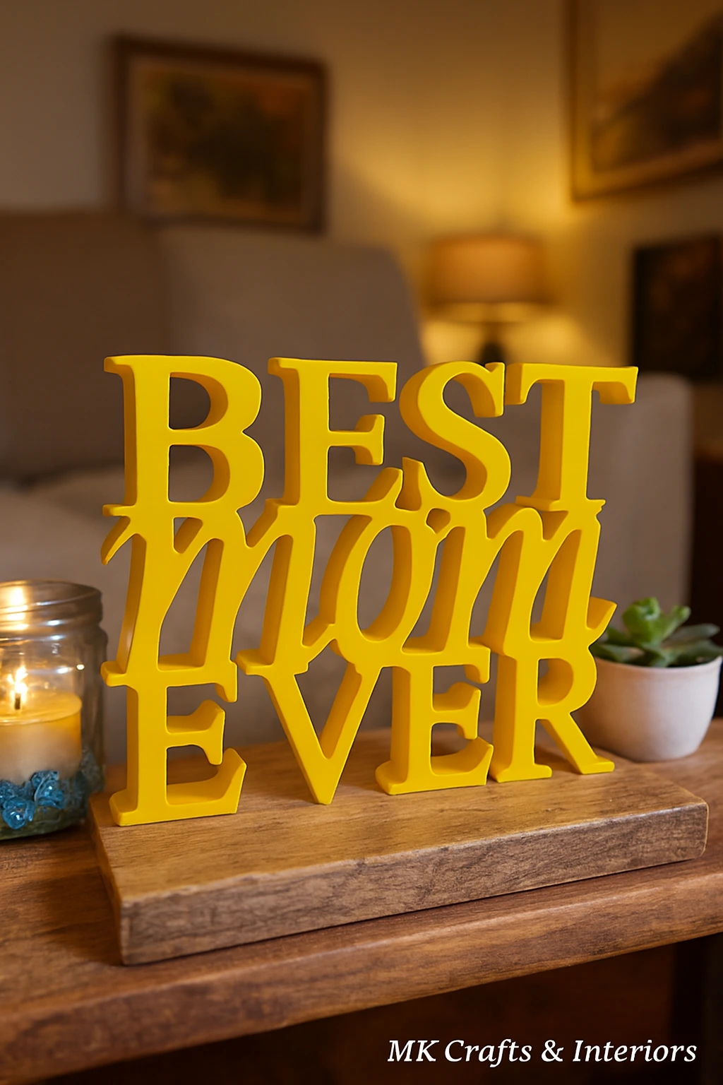 Yellow wooden “Best Mom Ever” decorative showpiece by MK Crafts displayed on a table with plant décor – handcrafted mother gift item.