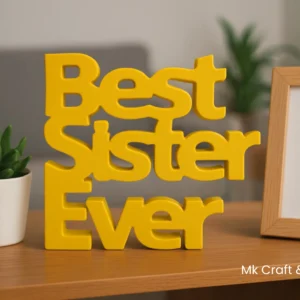 Best Sister Ever wooden decorative tabletop in peach color by MK Crafts & Interiors Hyderabad placed on a bedside table with candle and books.