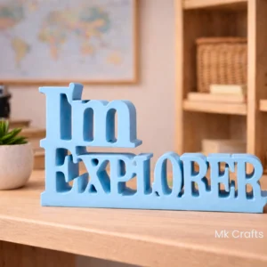 Light blue “I’m Explorer” wooden decorative showpiece by MK Crafts & Interiors in Hyderabad placed on desk – travel themed home décor gift.