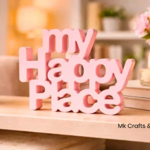 Light pink “My Happy Place” wooden decorative showpiece by MK Crafts & Interiors Hyderabad displayed on shelf.