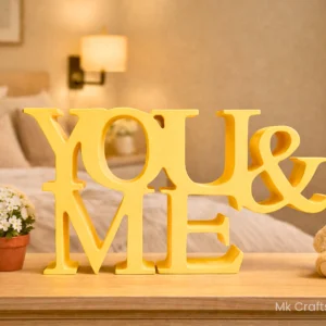Yellow You & Me wooden decorative showpiece for bedroom and couple home décor by MK Crafts & Interiors Hyderabad.