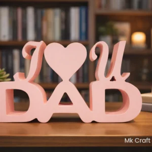 Light pink wooden “I Love You Dad” showpiece with heart design by MK Crafts placed on a table – handcrafted gift for father.