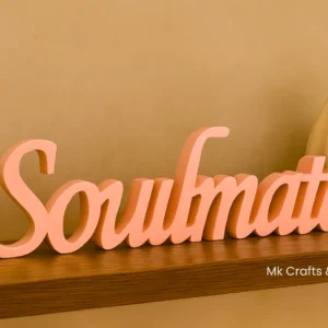 Light pink Soulmate wooden decorative showpiece by MK Crafts & Interiors Hyderabad displayed on wooden shelf – romantic home décor.
